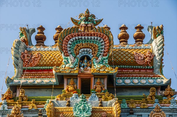 Colorful and decorated Hindu temple with idols of Hindu worship
