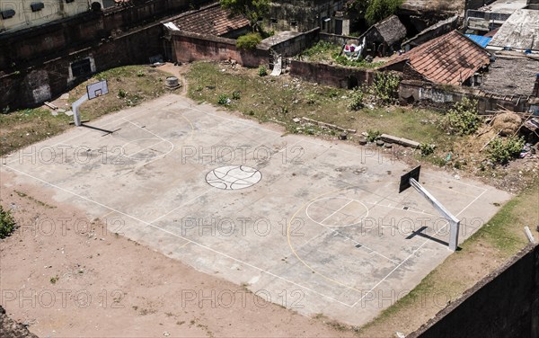 Basketball court and hoops at slum