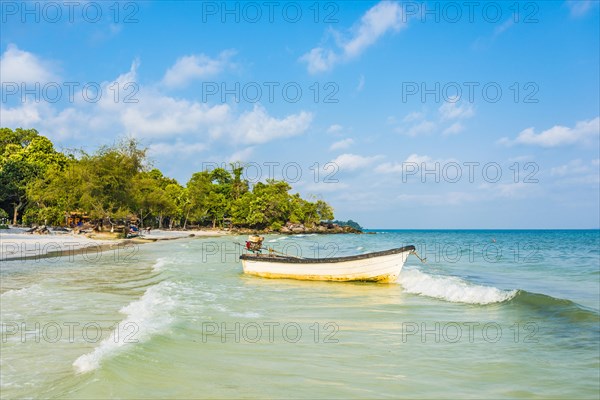 Idyllic beach with motor boat