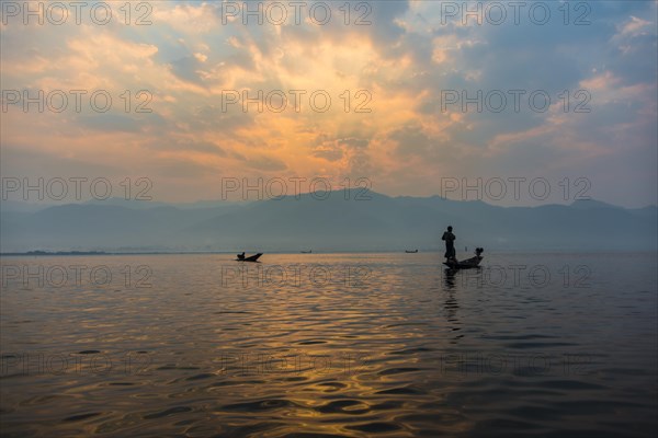 Local Intha fisherman rowing boats
