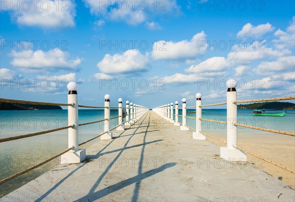 Pier on beach with turquoise water at Saracen Bay on Koh Rong Sanloem island