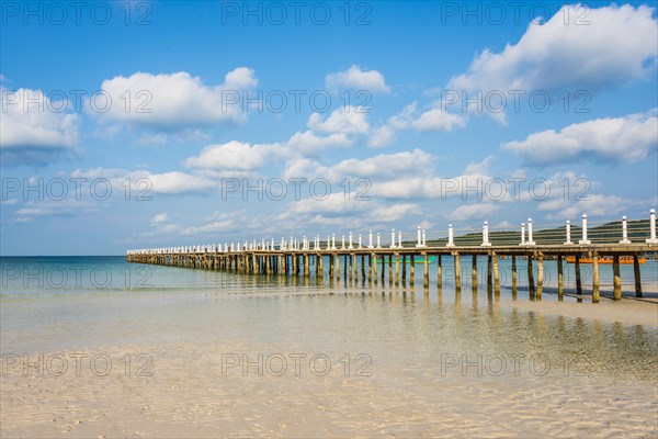 Pier on beach with turquoise water at Saracen Bay on Koh Rong Sanloem island