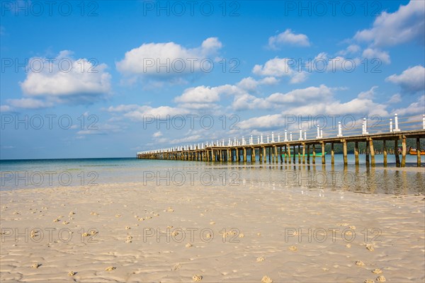 Pier on beach with turquoise water at Saracen Bay on Koh Rong Sanloem island