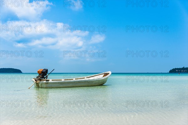 Motorboat on idyllic sandy beach