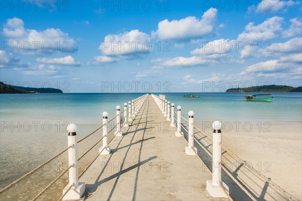 Pier on beach with turquoise water at Saracen Bay on Koh Rong Sanloem island