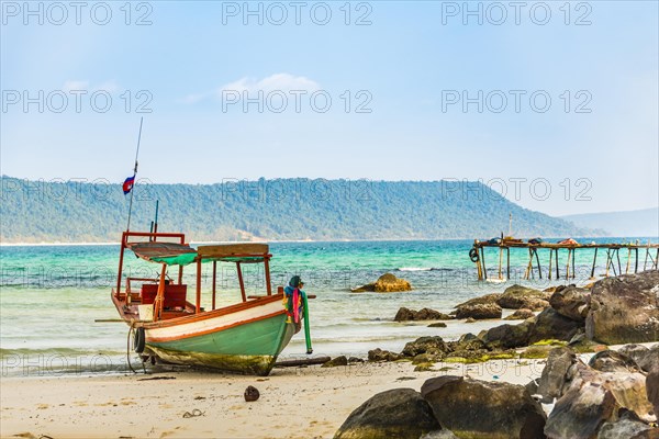 Idyllic sandy beach with traditional long-tail boat at Long Beach