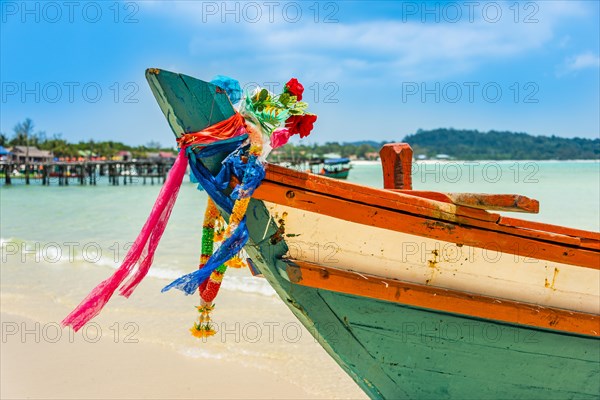 Idyllic sandy beach with traditional long-tail boat at Long Beach