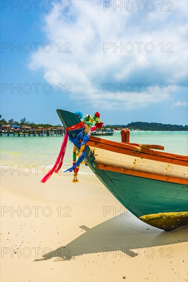 Idyllic sandy beach with traditional long-tail boat at Long Beach