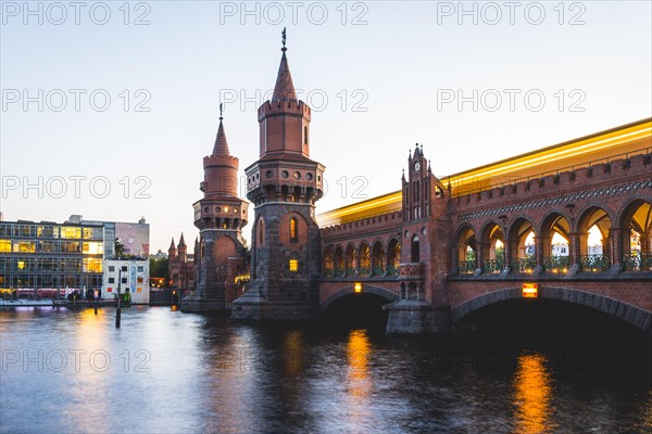 Oberbaum Bridge with underground between Kreuzberg and Friedrichshain at sunset