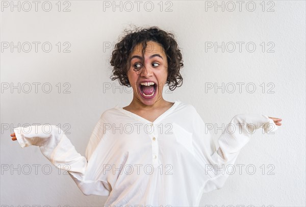 Young woman grimaces