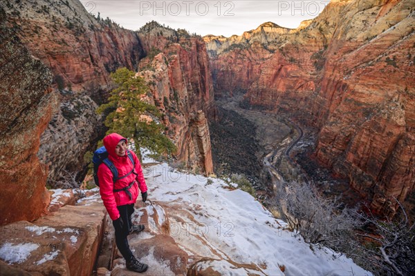 Young woman descending from Angels Landing