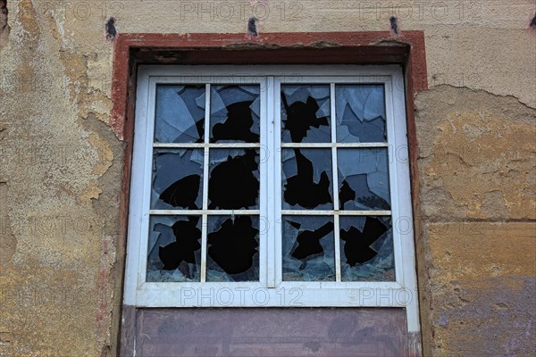 Broken window with glazing bars