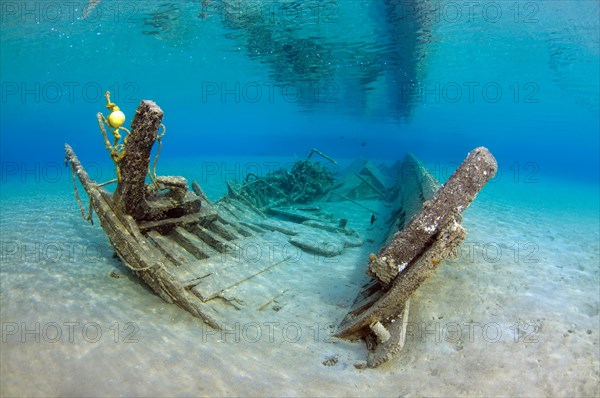 Old shipwrecked fishing boat on sandy seabed