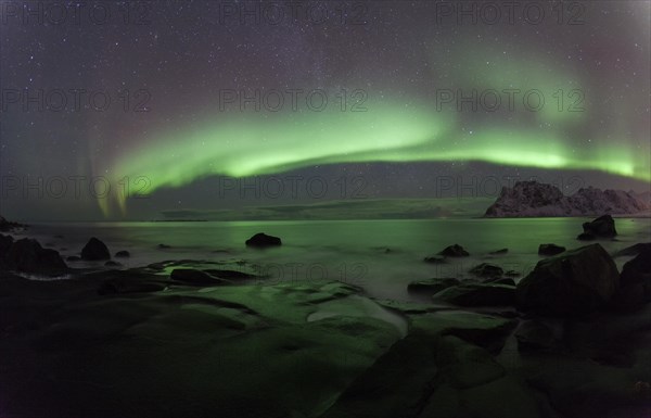 Beach of Utakleiv with Aurora Borealis