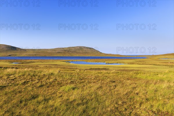 Barren landscape with meadows and glacial lakes