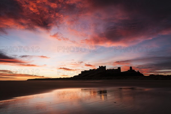 Bamburgh Castle viewed from Bamburgh Beach at sunrise