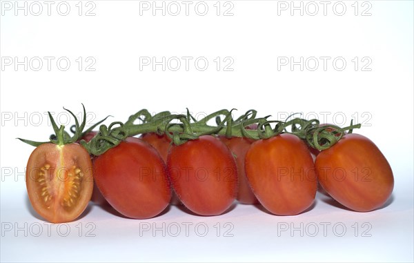 Vine tomatoes with one cut in half