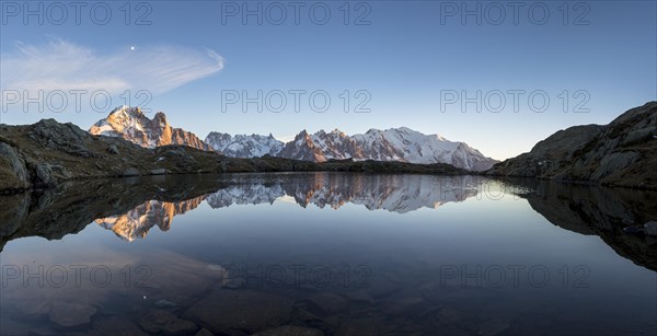 Panorama of Mont Blanc massif with reflection in the Lac des Chesery