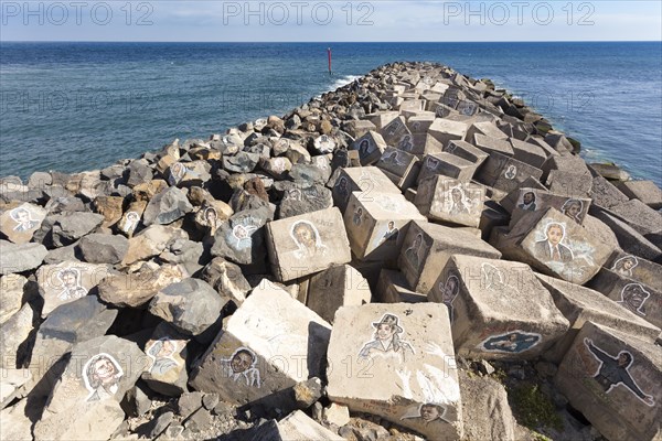 Pictures of famous musicians painted on stones at the Auditorio de Tenerife