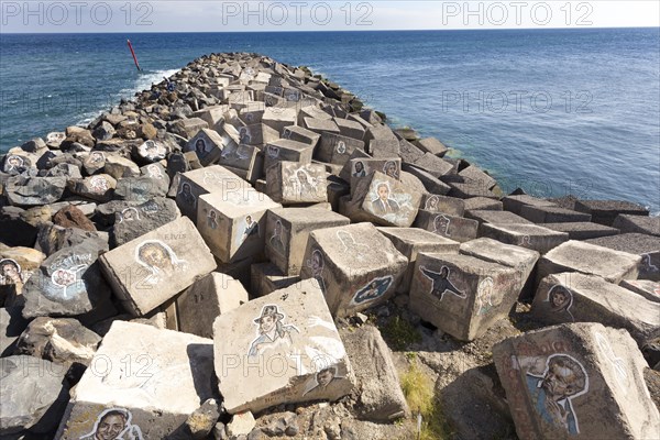 Pictures of famous musicians painted on stones at the Auditorio de Tenerife