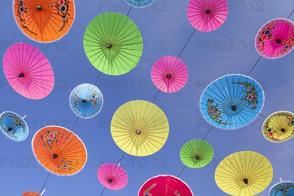 Colourful umbrellas suspended in the air at the umbrella festival in Bo Sang near Chiang Mai
