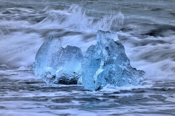 Beached blue icebergs in the surf of the Atlantic