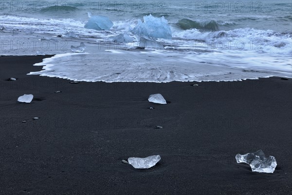 Stranded icebergs at the black lava of Breidarsandur