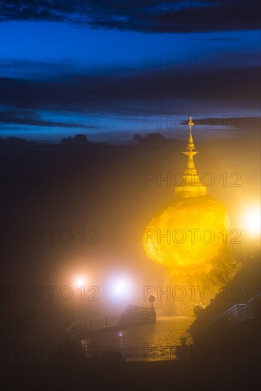 Illuminated Golden Rock at night with Kyaiktiyo Pagoda