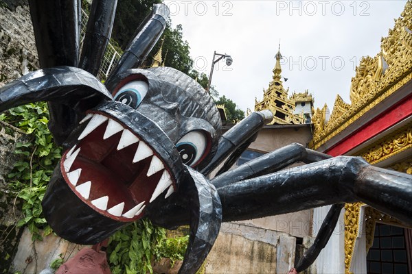 Figure of a giant spider at the entrance to Pindaya Cave