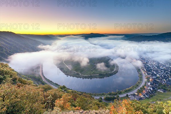 View of the bend in the Moselle at sunrise with clouds as seen from the Calmont ridge