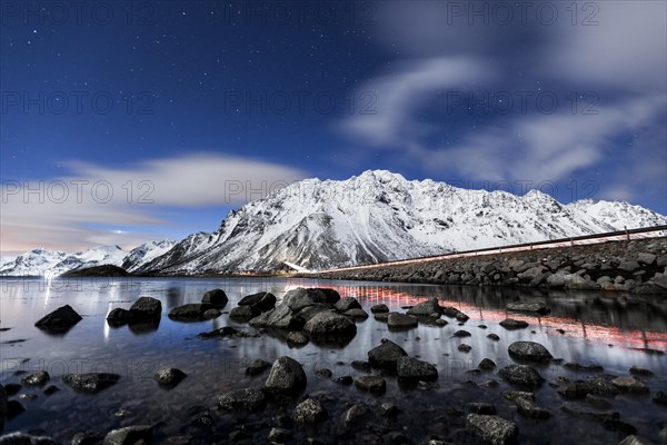 Gimsoystraumen bridge at night with a starry sky