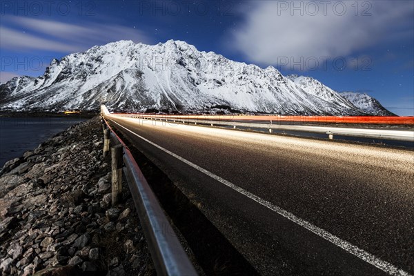 Gimsoystraumen bridge at night with a starry sky