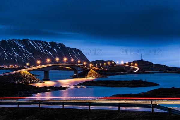 Illuminated bridge to the village Fredvang