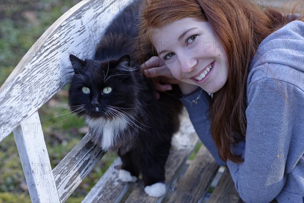 Girl with a black cat