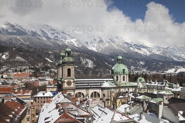 View from the town tower onto the city with the cathedral and the Karwendel Mountains