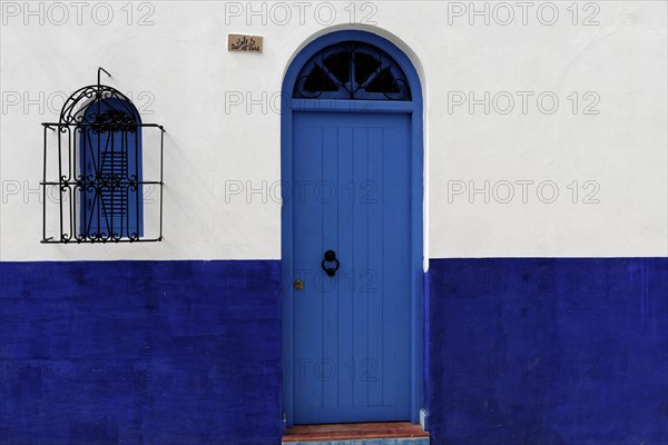 Housing front with blue front door
