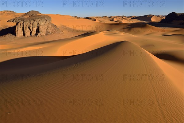 Sanddunes and rock towers at Moul Naga