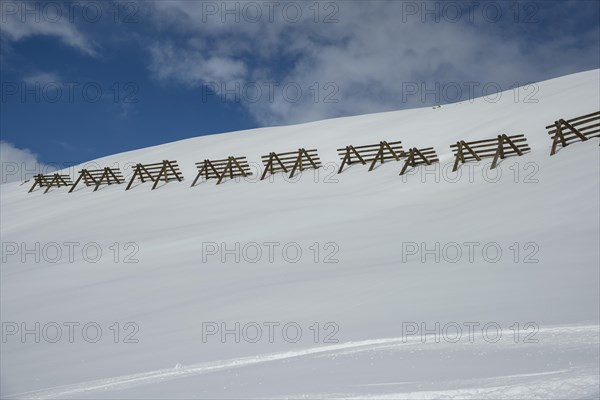 Avalanche control on the mountain slope with snow