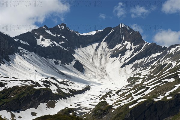 Kar with snow below the mountain peak Mont Sagerou and Dent de Barme