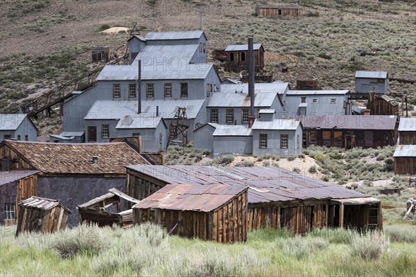 Old mining building behind old wooden houses