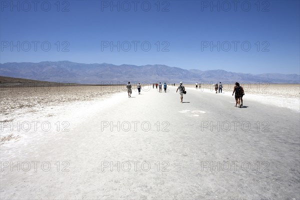 People walking Badwater Basin salt pan