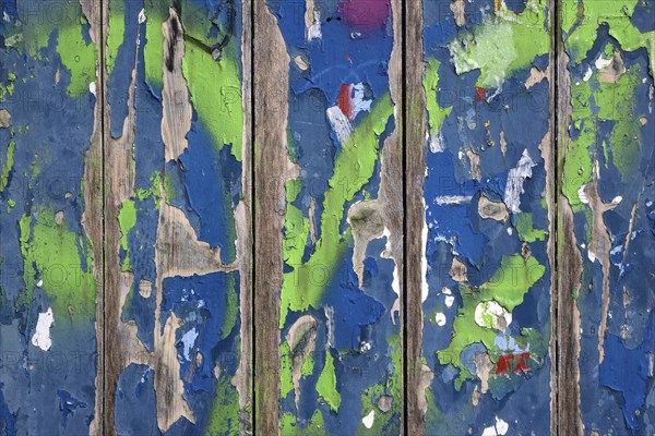 Flaked colorful paint on wooden boards