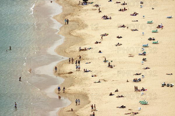 People lying on the beach