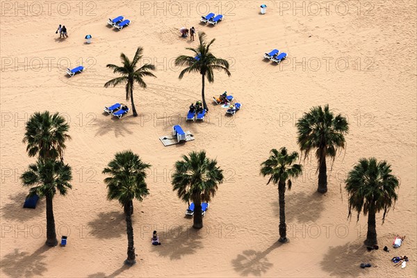 People lying on the beach