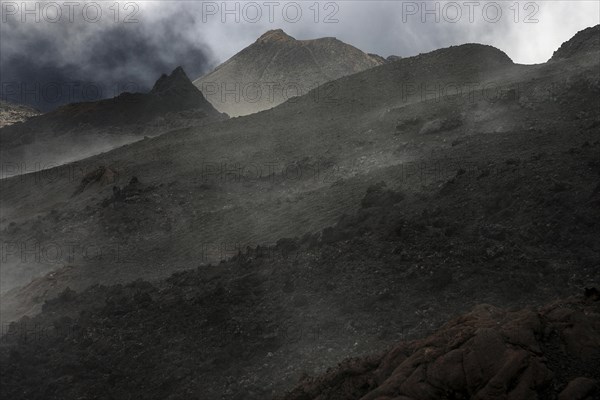 Volcanic landscape with clouds