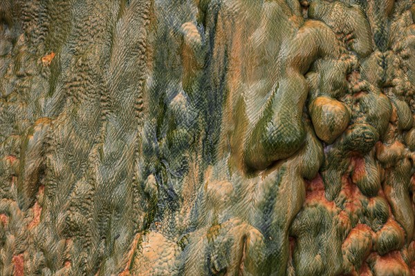 Colored mineral deposits in a thermal spring in Cilaos Cirque de Cilaos