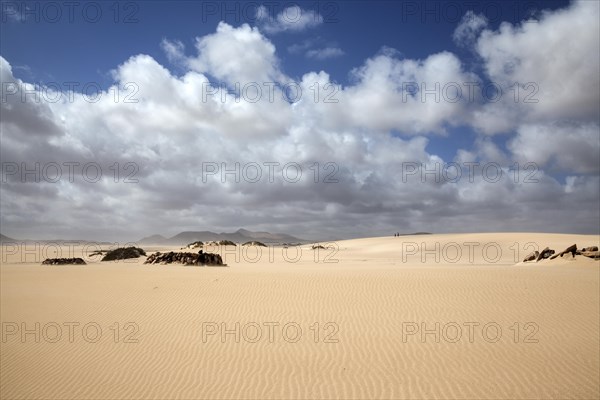 Sand dune with clouds