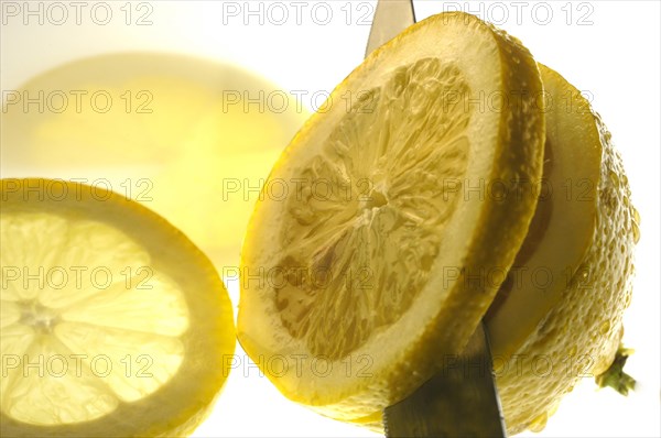 Cutting a juicy lemon in slices
