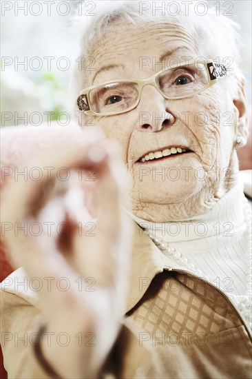 Senior suffering from dementia in her room at the nursing home