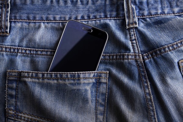 Smartphone in the pocket of jeans
